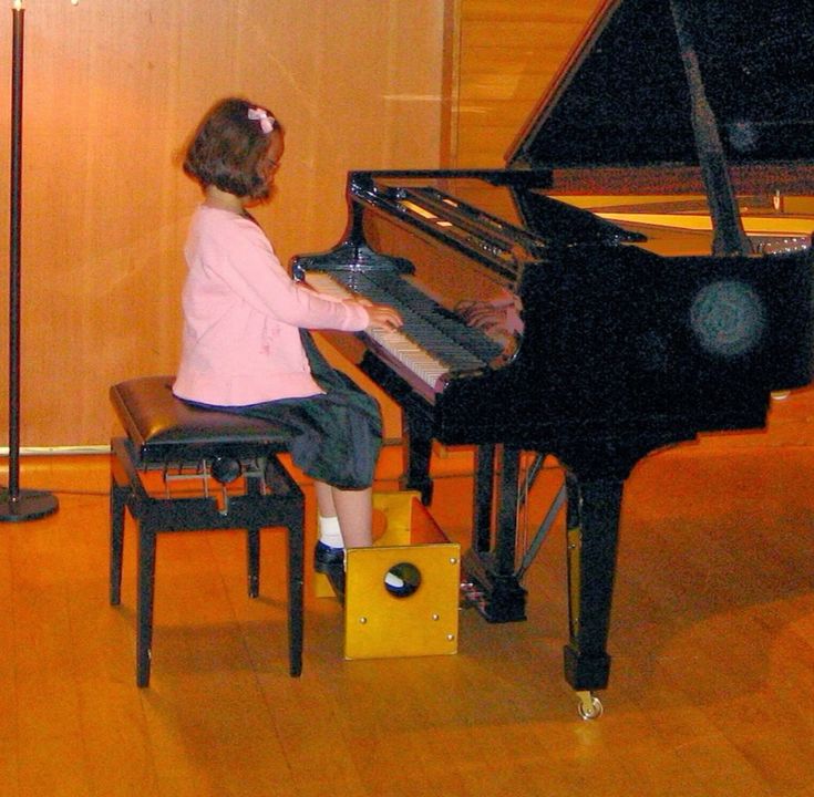 Young Laufey Playing The Piano